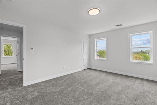 17 Upland Rd, Lynn, MA 01902 - carpeted empty room with attic access and baseboards
