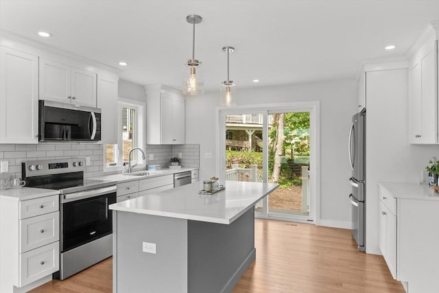 17 Upland Rd, Lynn, MA 01902 - kitchen with stainless steel appliances, backsplash, recessed lighting, white cabinets, and light countertops