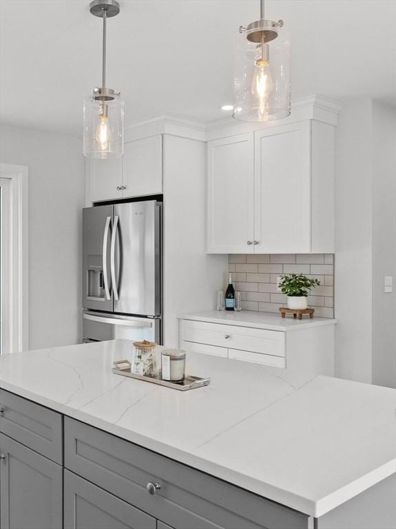 17 Upland Rd, Lynn, MA 01902 - kitchen with stainless steel fridge with ice dispenser, gray cabinetry, decorative backsplash, and light stone counters