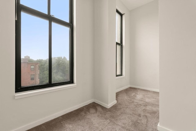 567 Tremont St Unit 20, Boston, MA 02118 - carpeted empty room featuring plenty of natural light