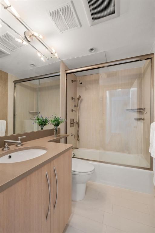 567 Tremont St Unit 20, Boston, MA 02118 - bathroom featuring vanity and tub / shower combination