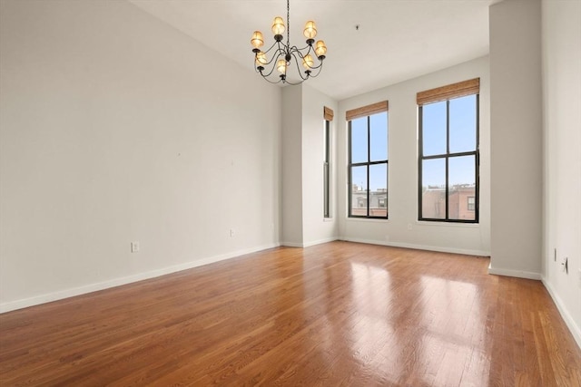 567 Tremont St Unit 20, Boston, MA 02118 - spare room with a chandelier and light wood-style flooring
