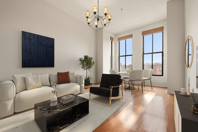 567 Tremont St Unit 20, Boston, MA 02118 - living room featuring wood finished floors and a chandelier