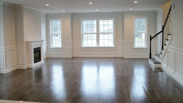 2 Mitchell Ln Unit B, Weymouth, MA 02190 - unfurnished living room with a decorative wall, wood finished floors, ornamental molding, stairway, and a wainscoted wall