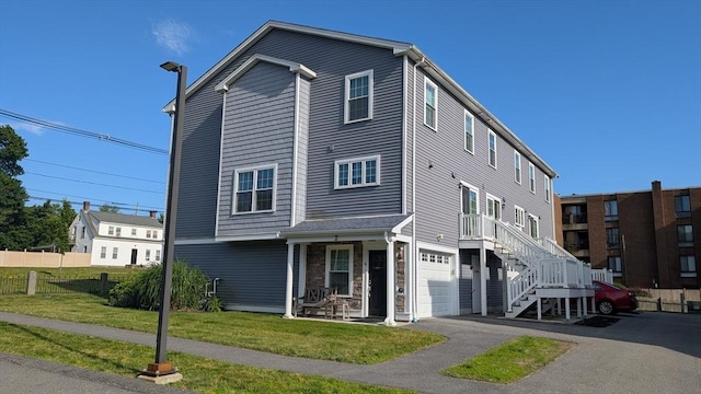 2 Mitchell Ln Unit B, Weymouth, MA 02190 - multi unit property featuring a garage, asphalt driveway, and covered porch