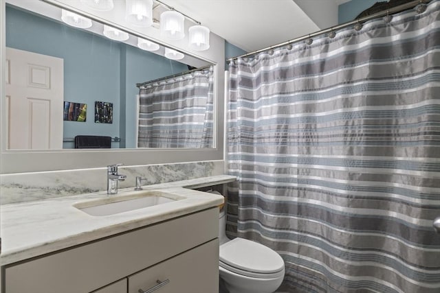 bathroom with toilet and vanity