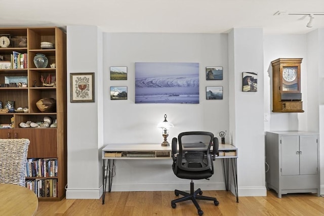 office space with light hardwood / wood-style flooring