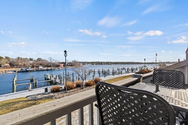 exterior space featuring a boat dock and a water view