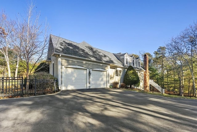 view of property exterior featuring a garage