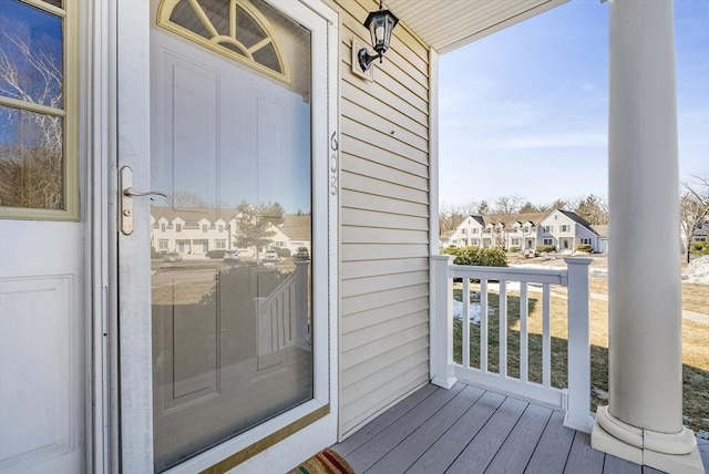 exterior space featuring covered porch and a residential view