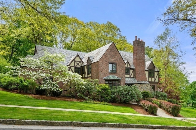 view of home's exterior with a lawn