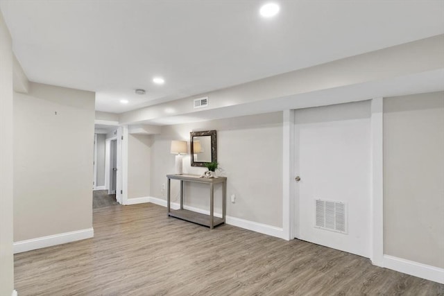 basement with wood-type flooring