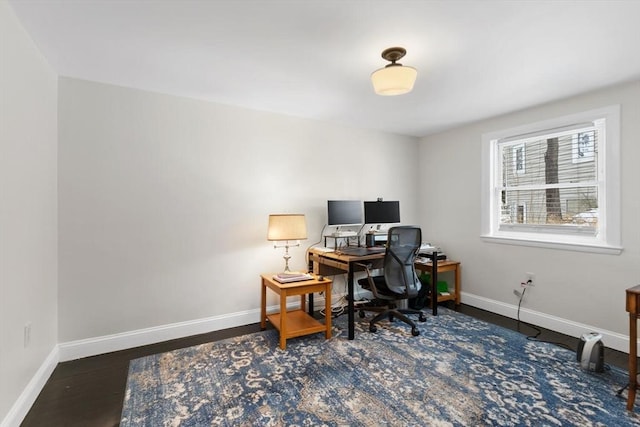 office space with dark hardwood / wood-style flooring