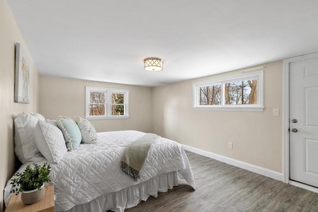 bedroom with wood-type flooring