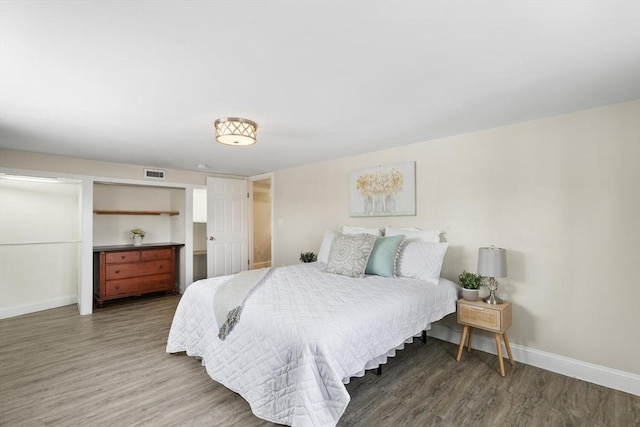 bedroom featuring dark hardwood / wood-style flooring