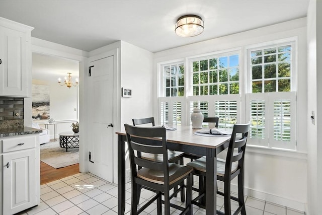 14 Wadsworth Ln, Duxbury, MA 02332 - dining space featuring light tile patterned floors and a chandelier
