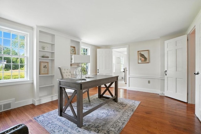 14 Wadsworth Ln, Duxbury, MA 02332 - home office with plenty of natural light, wood finished floors, and built in shelves
