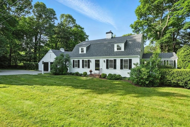 14 Wadsworth Ln, Duxbury, MA 02332 - colonial inspired home featuring a chimney, asphalt driveway, an attached garage, and a front lawn