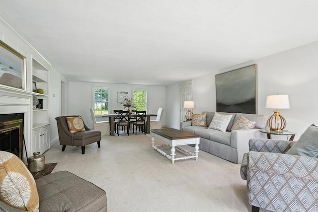 14 Wadsworth Ln, Duxbury, MA 02332 - living area featuring carpet floors, built in shelves, and a glass covered fireplace