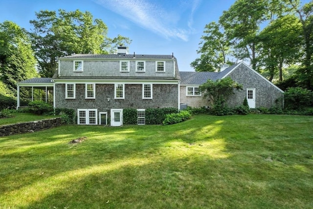 14 Wadsworth Ln, Duxbury, MA 02332 - back of house with a chimney and a lawn