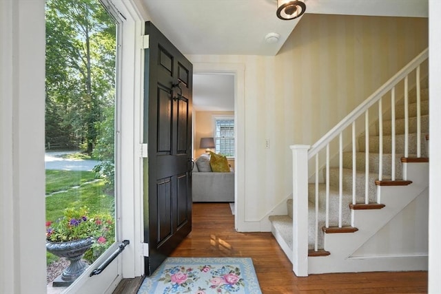 14 Wadsworth Ln, Duxbury, MA 02332 - foyer with wallpapered walls, wood finished floors, and stairway