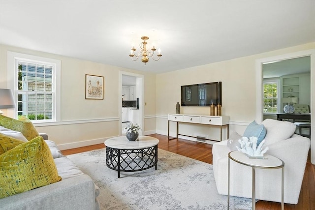 14 Wadsworth Ln, Duxbury, MA 02332 - living room with a chandelier, wood finished floors, and healthy amount of natural light