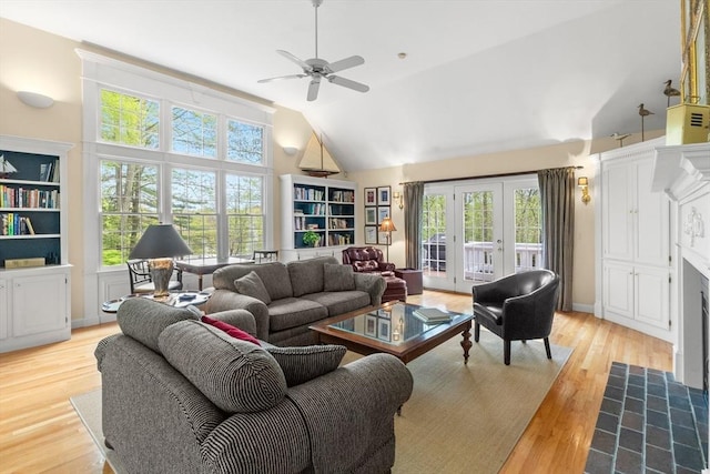 151 River Rd, West Newbury, MA 01985 - living room featuring plenty of natural light, high vaulted ceiling, ceiling fan, light wood-type flooring, and french doors
