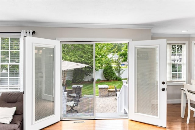 1380 Newman Ave, Seekonk, MA 02771 - doorway to outside featuring ornamental molding, wood finished floors, and baseboards
