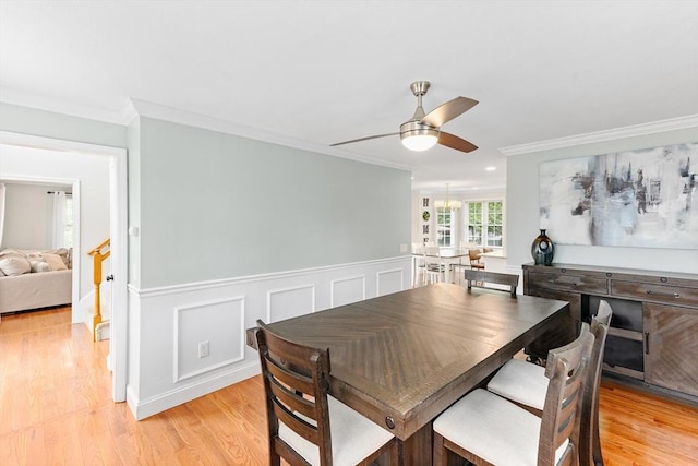 1380 Newman Ave, Seekonk, MA 02771 - dining space with a ceiling fan, light wood finished floors, crown molding, and wainscoting