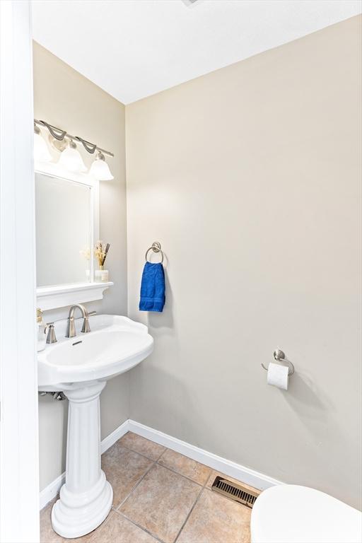 1380 Newman Ave, Seekonk, MA 02771 - half bathroom with baseboards, tile patterned floors, and toilet