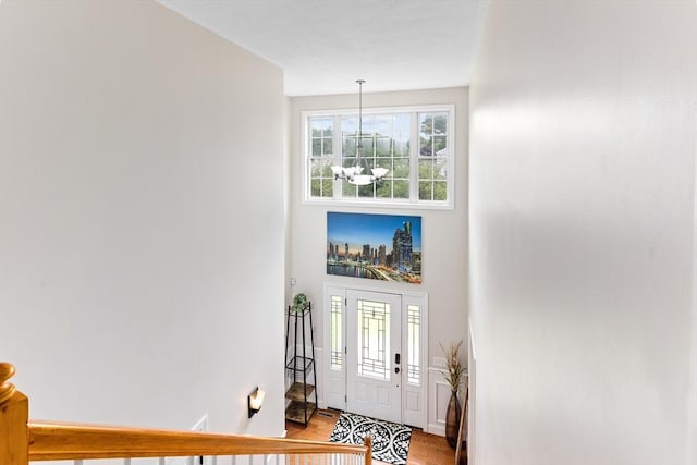 1380 Newman Ave, Seekonk, MA 02771 - entryway with a chandelier, light wood-style flooring, and a high ceiling