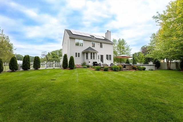 1380 Newman Ave, Seekonk, MA 02771 - rear view of house with roof mounted solar panels and a chimney