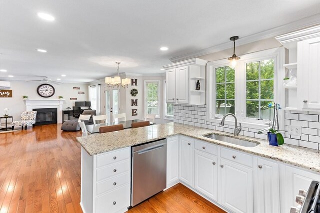 1380 Newman Ave, Seekonk, MA 02771 - kitchen with dishwasher, open shelves, a sink, a peninsula, and white cabinets