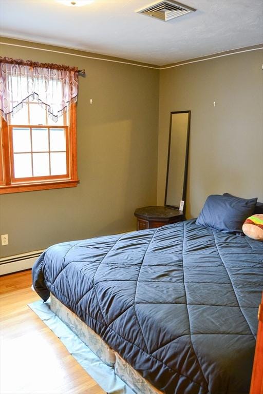 110 Mayflower Ridge Dr, Wareham, MA 02571 - bedroom with wood finished floors and baseboard heating