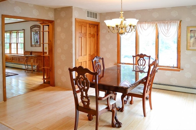 110 Mayflower Ridge Dr, Wareham, MA 02571 - dining area with a baseboard radiator, wallpapered walls, light wood-style floors, and a chandelier