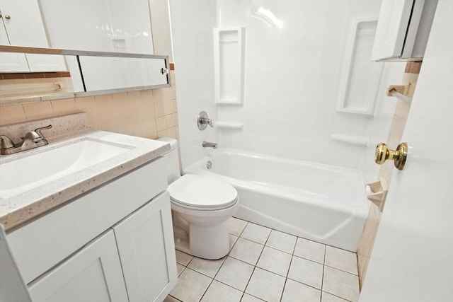 full bath with tile patterned flooring, decorative backsplash, vanity, toilet, and shower / bathing tub combination