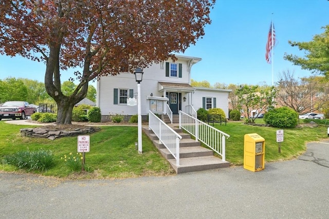 view of front of property with a front lawn