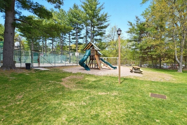 community playground with fence and a yard