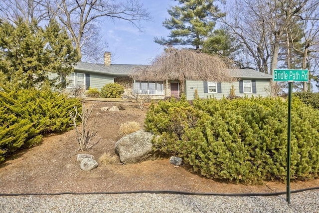 ranch-style house with a chimney