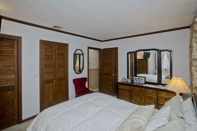 bedroom featuring light colored carpet, visible vents, two closets, and ornamental molding