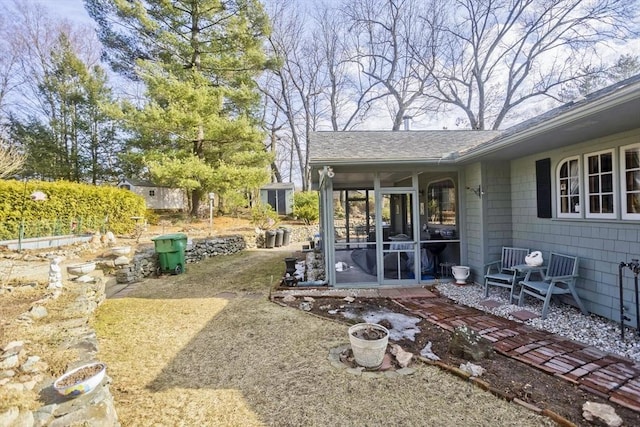 view of yard featuring a patio and a sunroom