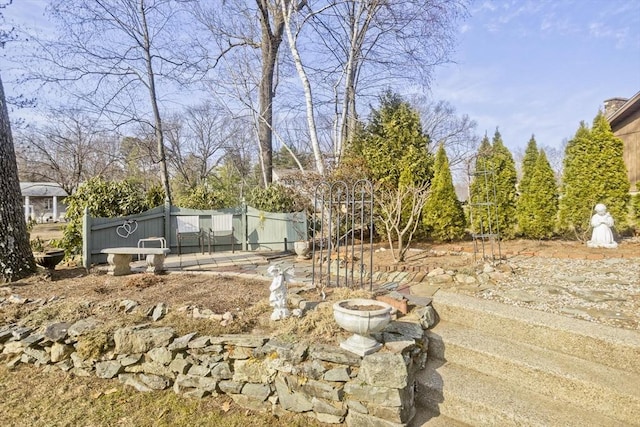 view of yard with a fire pit