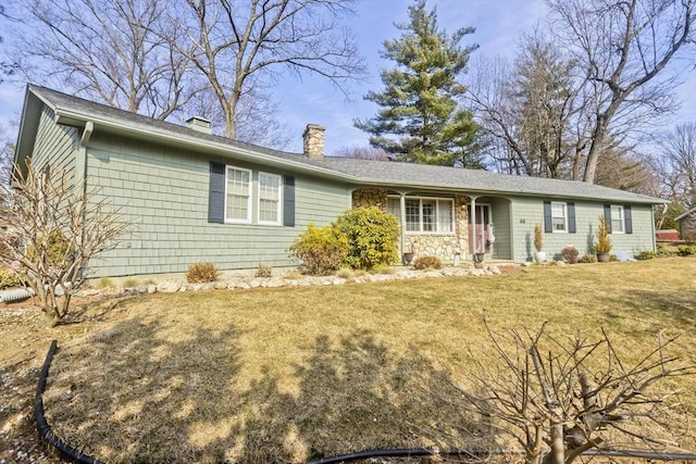 single story home featuring a front lawn and a chimney