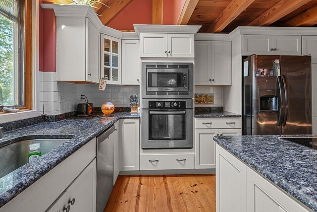 94 S Shore Rd, Burrillville, RI 02859 - kitchen featuring appliances with stainless steel finishes, light wood-style flooring, white cabinets, decorative backsplash, and wooden ceiling