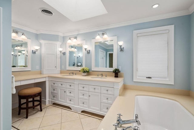 full bath featuring a bath, visible vents, a sink, and tile patterned floors