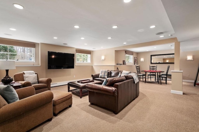 living room with baseboards, baseboard heating, light carpet, and recessed lighting