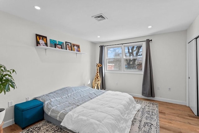 5257 Washington St Unit 5257, Boston, MA 02132 - bedroom with light wood-style floors, recessed lighting, and baseboards