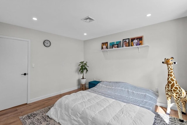 5257 Washington St Unit 5257, Boston, MA 02132 - bedroom featuring wood finished floors, recessed lighting, and baseboards