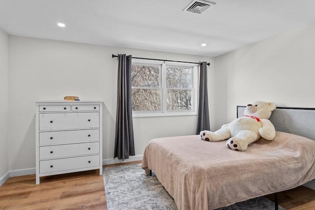 5257 Washington St Unit 5257, Boston, MA 02132 - bedroom featuring light wood-style flooring, baseboards, and recessed lighting