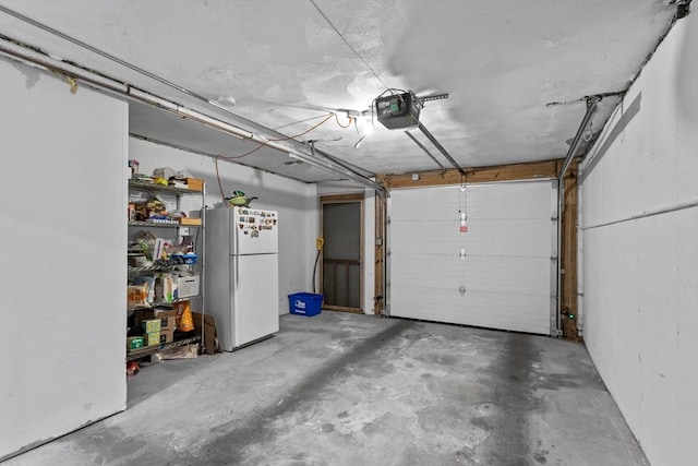 5257 Washington St Unit 5257, Boston, MA 02132 - garage with freestanding refrigerator and a garage door opener